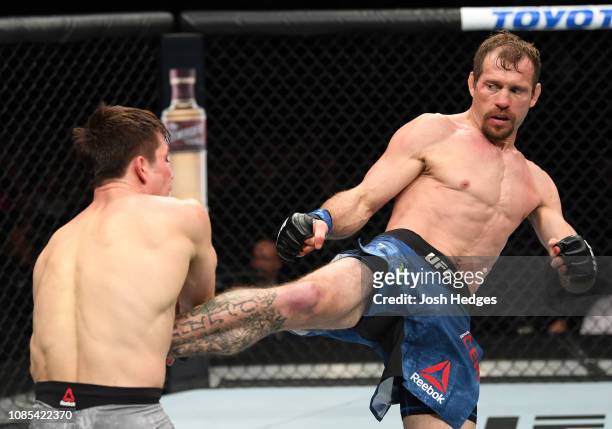 Donald Cerrone kicks Alexander Hernandez in their lightweight bout during the UFC Fight Night event at the Barclays Center on January 19, 2019 in the...