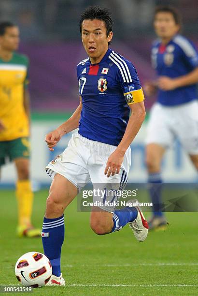 Makoto Hasebe of Japan in action during the AFC Asian Cup Final match between the Australian Socceroos and Japan at Khalifa International Stadium on...