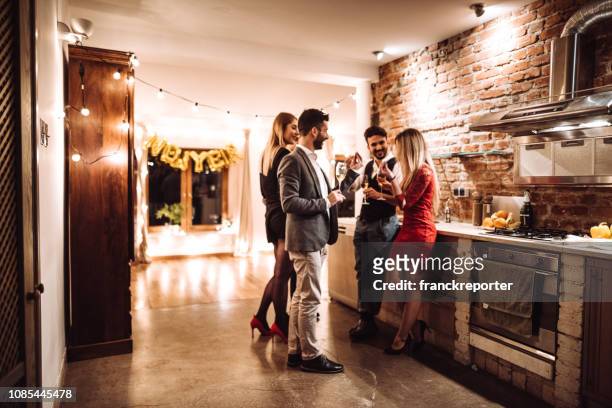 friends celebrating the new year party at home - dinner party stock pictures, royalty-free photos & images