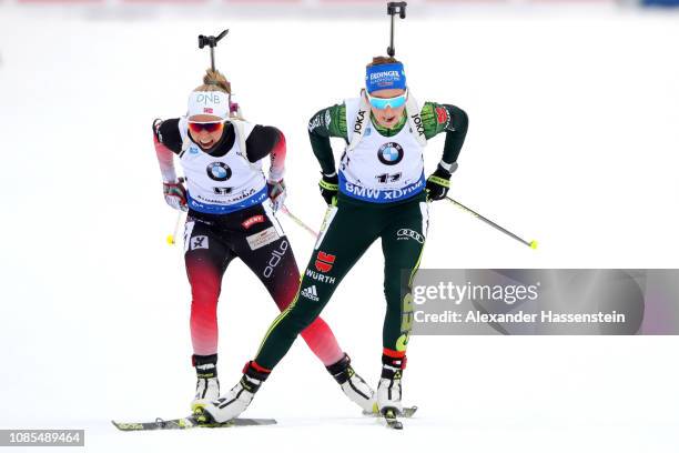 Franziska Preuss of Germany wins the Women 12.5 km Mass Start ahead of Ingrid Landmark Tandrevold of Norway during the IBU Biathlon World Cup at...