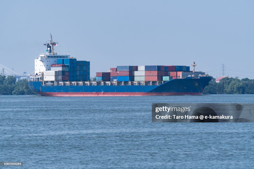 The cargo sailing on Chao Phraya River in Samut Prakan Province in Thailand