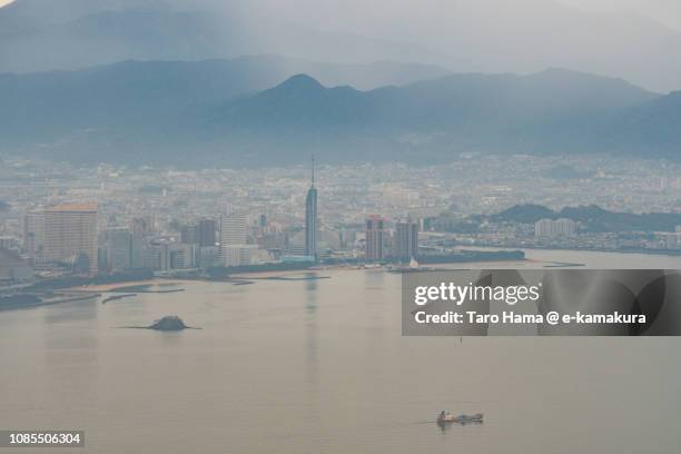 hakata bay and fukuoka city in japan daytime aerial view from airplane - hakata bay stock pictures, royalty-free photos & images