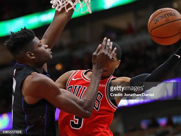 Mo Bamba of the Orlando Magic hits Shaquille Harrison of the Chicago Bulls in the face during their game at United Center on December 21, 2018 in...