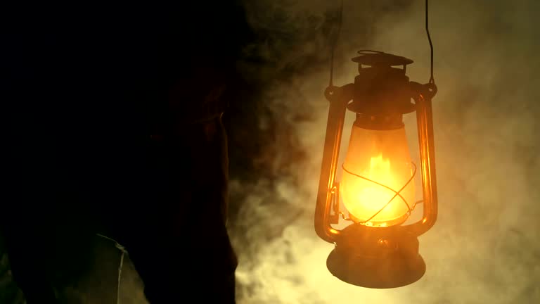 https://media.gettyimages.com/id/1085557210/video/man-hand-holding-a-kerosene-lamp-at-night.jpg?b=1&s=640x640&k=20&c=P6sB9ahlh03P8mNnNGDaD_xEaJwgYPA4tNpBffxjj1s=