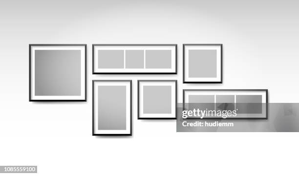 vector blank picture frame set on the wall background - museum interior stock illustrations