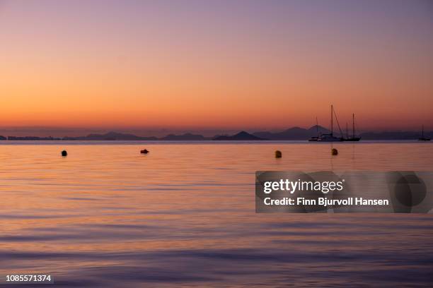 cityscape of la manga from mar menor spain - sunrise after the longest night in history - la manga stock-fotos und bilder