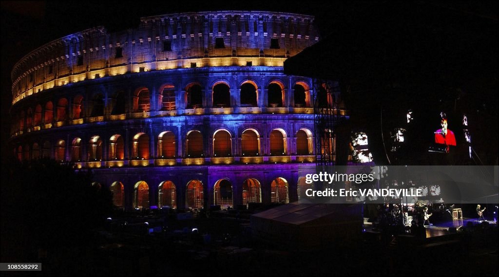 Paul McCartney performed inside Rome's ancient Colosseum for an exclusive charity show before 400 people who paid up to $1500 to listen up-close the ex-Beatle inside ancient gladiatorial stage, bathed in multicolored lights for the occasion in Rome, Italy