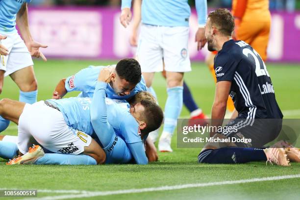 Dario Vidosic of the City is mobbed as he celebrates a goal during the round nine A-League match between Melbourne City and Melbourne Victory at AAMI...