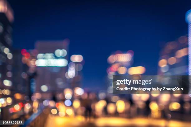 bokeh image of night view of tokyo station illuminated with blue sky, chiyoda ward, japan. - hyperopia ストックフォトと画像