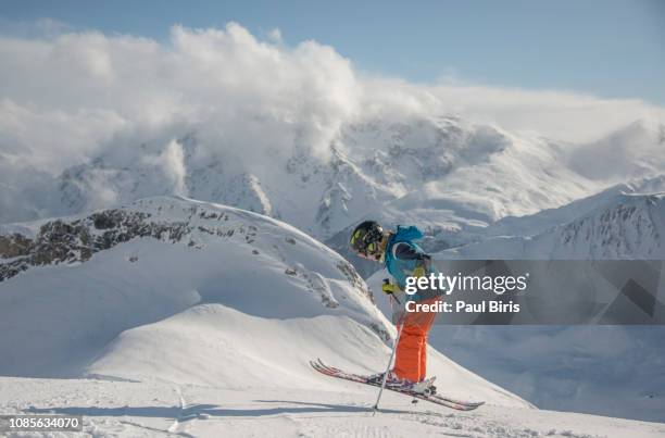 action shot of teenager jumping with his skis, the ski resort ischgl silvretta arena, austria - les arcs stock-fotos und bilder