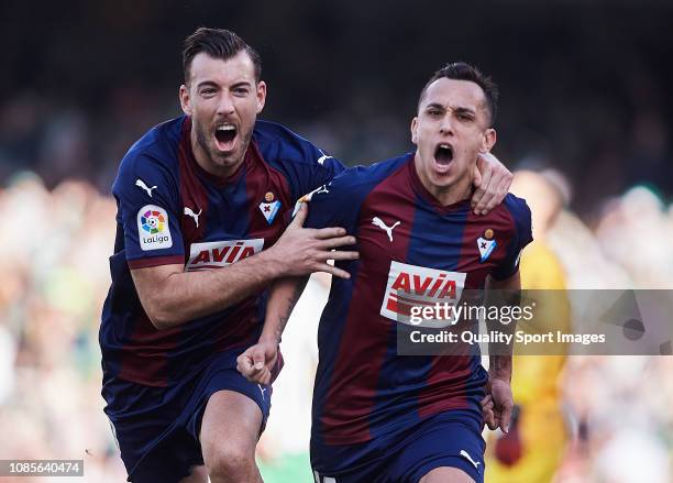 Fabian Orellana and Sergi Enrich of SD Eibar celebrate scoring their team's opening goal during the La Liga match between Real Betis Balompie and SD...