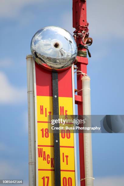 a high striker, also known as a strength tester, or strongman game, photographed at the coney island amusement park, brookyn, new york city, usa - bell hammer stock pictures, royalty-free photos & images