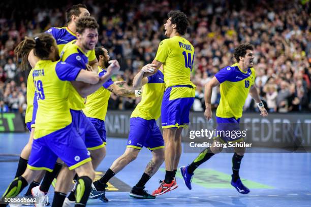 Thiagus Petrus Santos and Jose Toledo of Brazil react after their win during the Main Group 1 match at the 26th IHF Men's World Championship between...