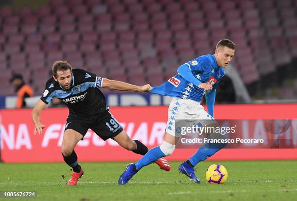 Senad Lulic of SS Lazio vies Piotr Zielinski of SSC Napoli during the Serie A match between SSC Napoli and SS Lazio at Stadio San Paolo on January...