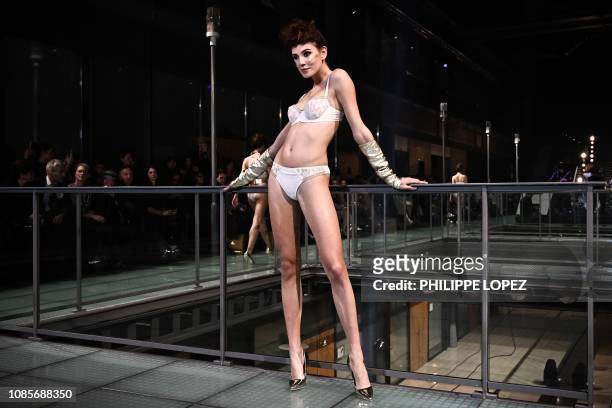 Model presents a creation of French lingerie during the fashion show "Lingerie Rocks" in Paris on January 20, 2019. - The show featured French brands...