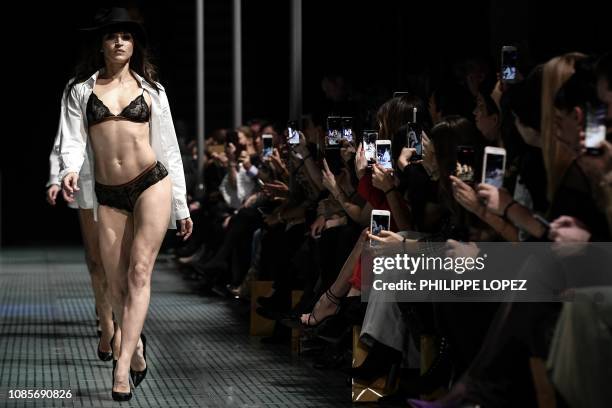 Model presents a creation of French lingerie during the fashion show "Lingerie Rocks" in Paris on January 20, 2019. - The show featured French brands...