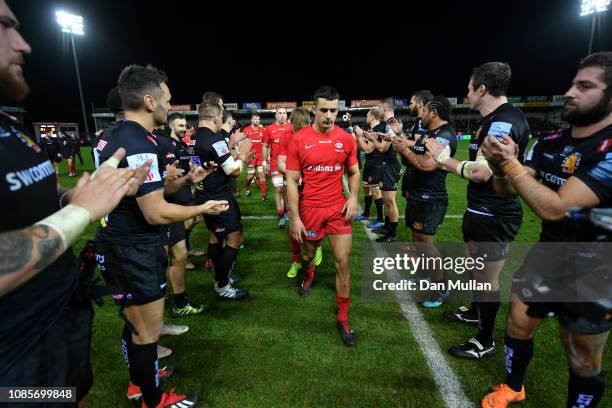 Alex Lozowski of Saracens leads the team off the field dejected following their side's loss during the Gallagher Premiership Rugby match between...