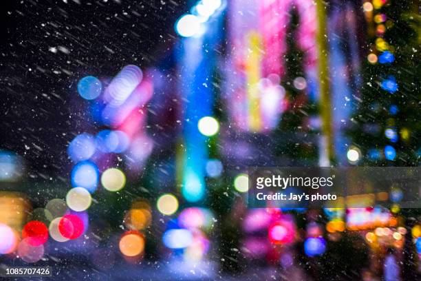night with snow - new york city lights stock pictures, royalty-free photos & images