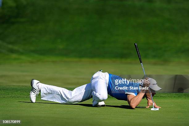 Camilo Villegas of Colombia is seen in his spiderman pose at the 13th green during the third round of the Farmers Insurance Open held at Torrey Pines...