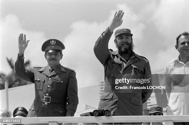 Cuban politician and Prime Minister Fidel Castro and his brother, politician Raul Castro attend the traditional May Day parade on Revolution Square...