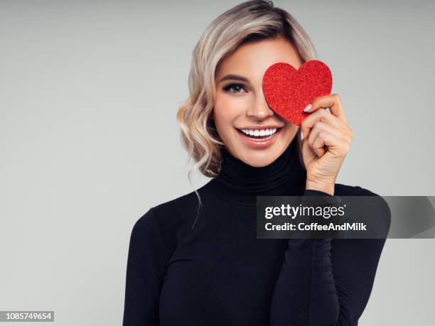 beautiful woman cardboard heart - hair love stock pictures, royalty-free photos & images