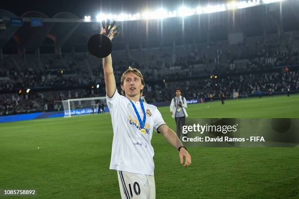 Luka Modric of Real Madrid holds the FIFA Club World Cup trophy following the FIFA Club World Cup UAE 2018 Final between Al Ain and Real Madrid at...
