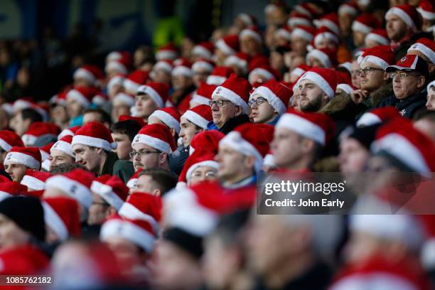 Southampton fans wear christmas hats during the Premier League match between Huddersfield Town and Southampton FC at John Smith's Stadium on December...