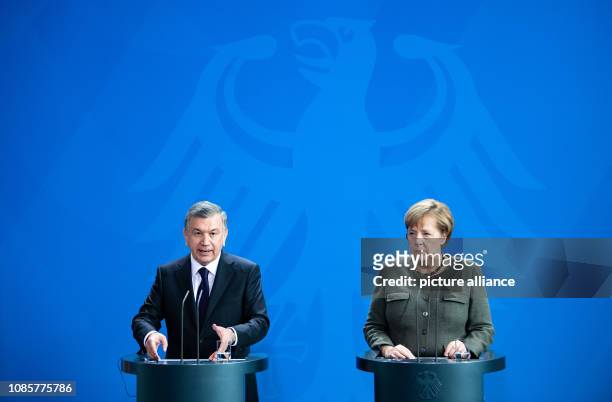 January 2019, Berlin: Federal Chancellor Angela Merkel and Shavkat Mirsiyoyev, President of Uzbekistan, speak at a press conference before their...