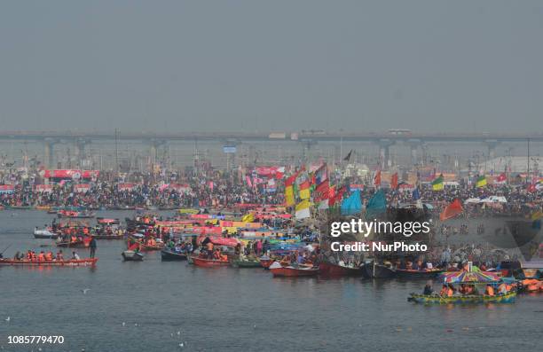 Indian hindu devotees gather on the banks of holy sangam, confluence of three rivers Ganges, Yamuna and mythological saraswati , to take a holy dip...