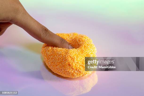 beads slime with human hand - slime bildbanksfoton och bilder