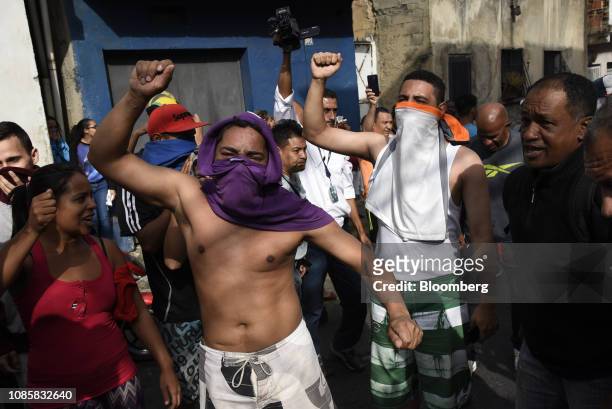 Demonstrators chant during a protest in the Cotiza neighborhood of Caracas, Venezuela, on Monday, Jan. 21, 2019. A number of rebel national guardsmen...