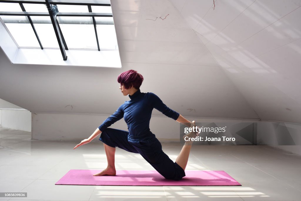 Middle age woman practicing yoga