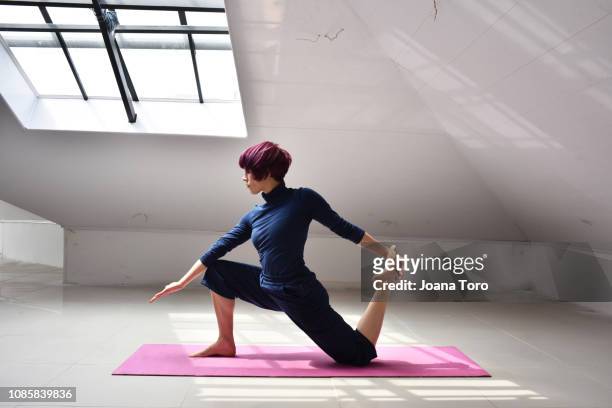 middle age woman practicing yoga