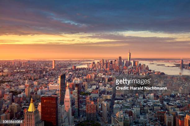 aerial view of lower manhattan skyline at sunrise, new york city, new york, united states - lower manhattan stock pictures, royalty-free photos & images