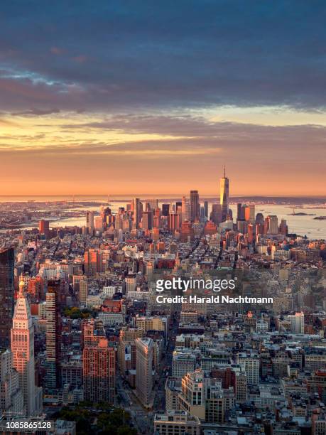 aerial view of lower manhattan skyline at sunrise, new york city, new york, united states - lower manhattan stock-fotos und bilder