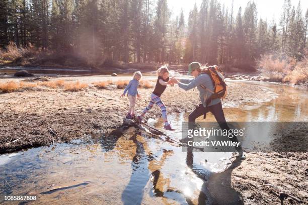 mother and children play, climb, hike, run, and adventure in yosemite. - california strong stock pictures, royalty-free photos & images