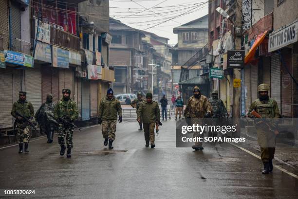 Indian army men seen patrolling the street of Srinagar during restrictions. Kashmiris mark 29th anniversary of Gaw Kadal massacre. More than 50...