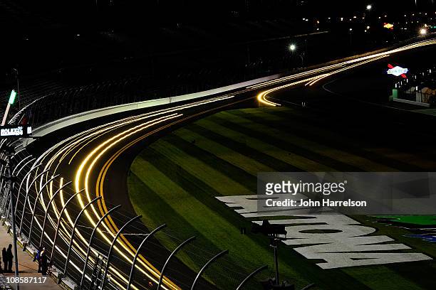 Cars race along the front stretch during the Rolex 24 at Daytona International Speedway on January 29, 2011 in Daytona Beach, Florida.