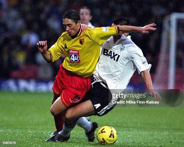 Tommy Smith of Watford is brought down by Ryan Kidd of Preston North End in the Nationwide League Division One match between Watford and Preston...