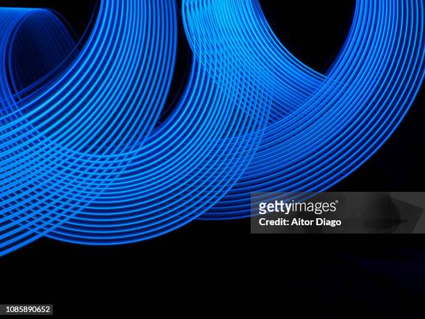blue curved lines forming a way. rhytm - shapes and sizes stock-fotos und bilder