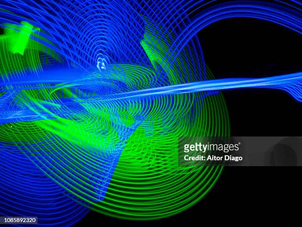 blue, green curved lines forming planets in the space. light painting - venus berlin bildbanksfoton och bilder