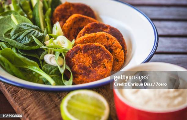 red lentil and quinoa barbeque burger patties, close-up - red lentil stock pictures, royalty-free photos & images