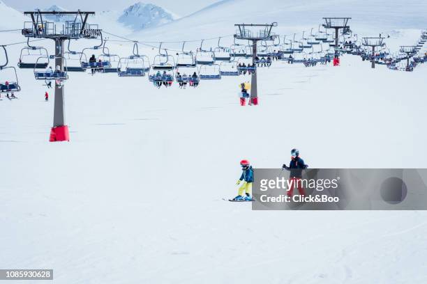 people dressed in ski clothes learning to ski - andalucian sierra nevada stock pictures, royalty-free photos & images