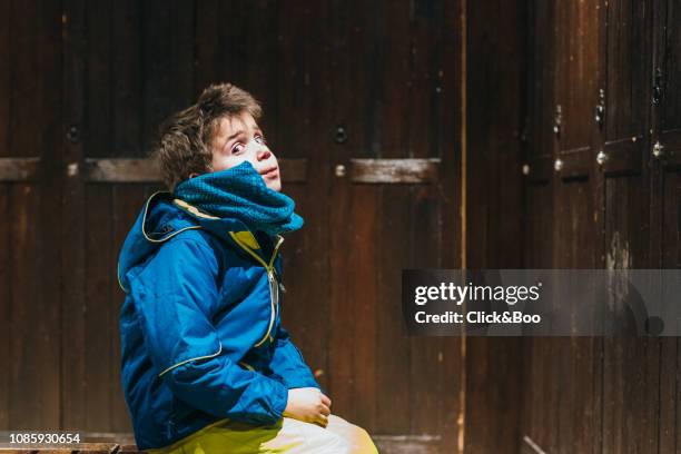 little boy dressed in ski clothes inside a ski closet - dressing up stock photos et images de collection