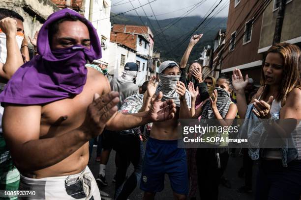 Protesters shouting slogans during a protest against Nicolas Maduro. 27 Military officers of the National Guard were arrested after revolting in the...