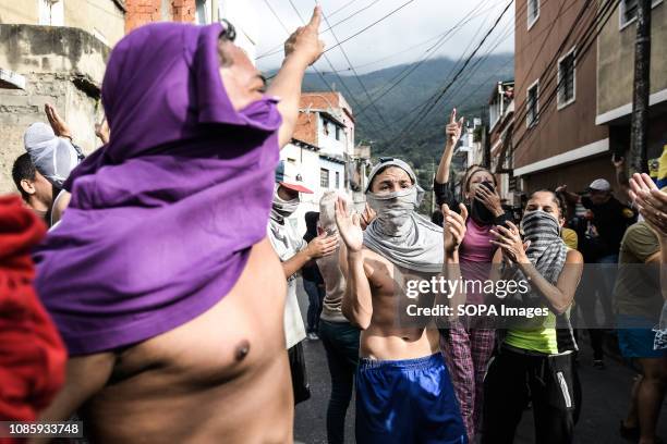 Protesters shouting slogans during a protest against Nicolas Maduro. 27 Military officers of the National Guard were arrested after revolting in the...