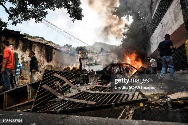 Barricades in the streets of Caracas seen during a protest against Nicolas Maduro. 27 Military officers of the National Guard were arrested after...