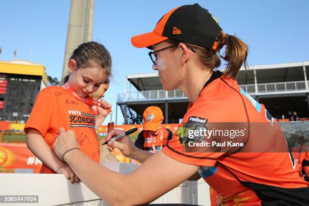 Lauren Ebsary of the Scorchers signs autographs for supporters after winning the Women's Big Bash League match between the Perth Scorchers and the...