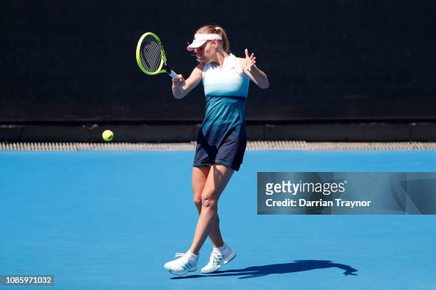 Barbara Schett of Austria plays a forehand in her Women's Legends Doubles match with Mary Joe Fernandez of the United States against Martina...