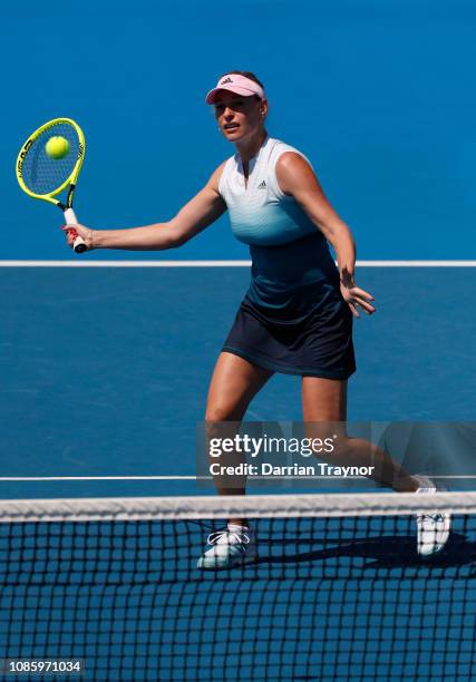 Barbara Schett of Austria plays a forehand in her Women's Legends Doubles match with Mary Joe Fernandez of the United States against Martina...